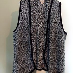 Sweater vest, black and silver with black trim.
